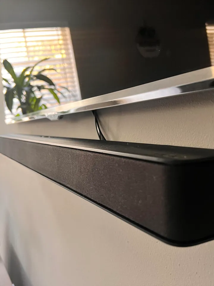 TV installed with a soundbar and a power bridge