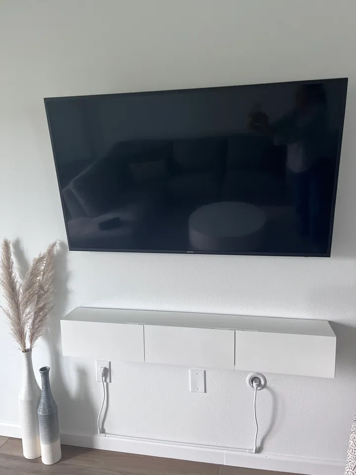 TV installed with a power bridge for fully hidden cables